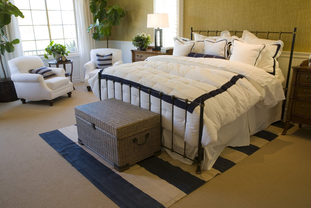 White bedding and soft white reading chairs give this bedroom a lightness it otherwise wouldn't have with it's beige color scheme White bedding and soft white reading chairs give this bedroom a lightness it otherwise wouldn't have with it's beige color scheme