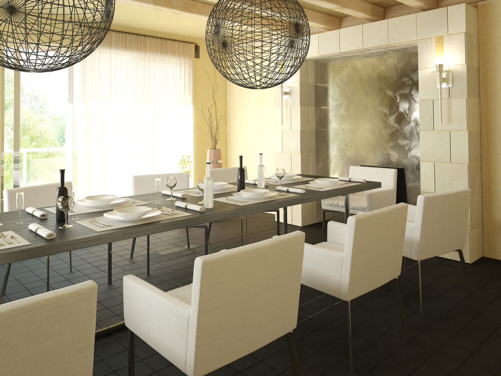 Modern dining room design with long grey table surrounded by steel and white dining chairs. Modern dining room design with long grey table surrounded by steel and white dining chairs.