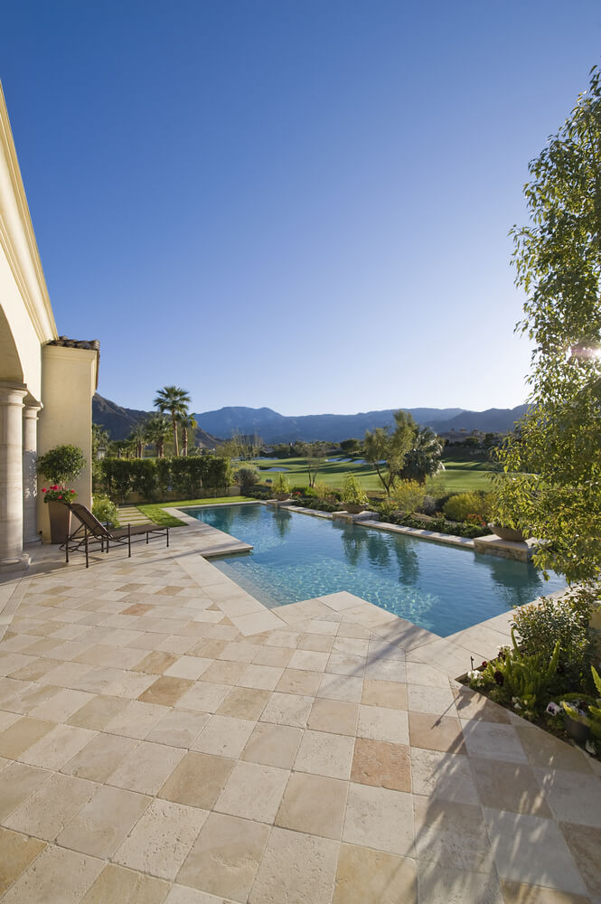 Small pool on the edge of a golf course bordered on one side with garden landscaping. HOme has unobstructed view of the manicured golf course. Small pool on the edge of a golf course bordered on one side with garden landscaping. HOme has unobstructed view of the manicured golf course.