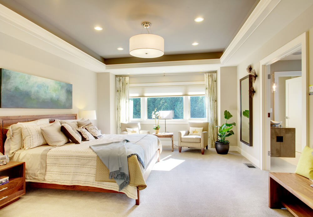 The white color scheme creates a bright oasis of a bedroom given that there is only one window The white color scheme creates a bright oasis of a bedroom given that there is only one window