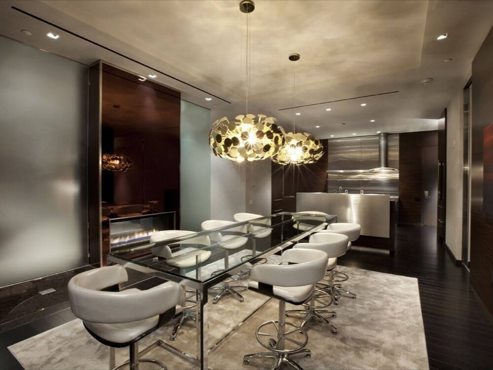 Very modern windowless dining room in dark brown, white, glass and stainless steel Very modern windowless dining room in dark brown, white, glass and stainless steel