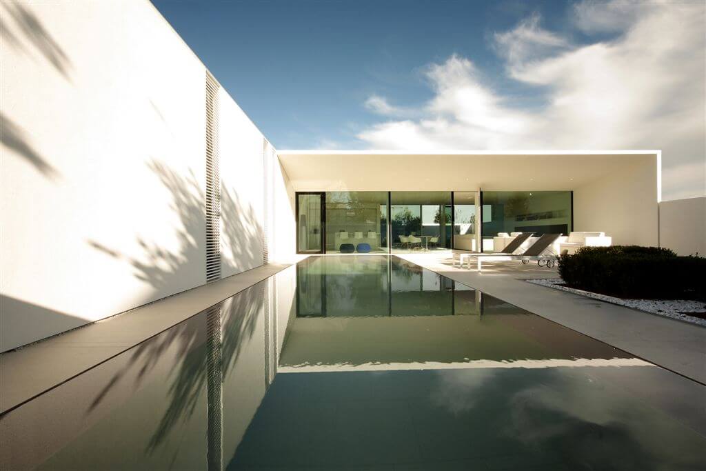 Here's the opposite view of the pool area, with floor to ceiling windows extending the length of the home. Here's the opposite view of the pool area, with floor to ceiling windows extending the length of the home.