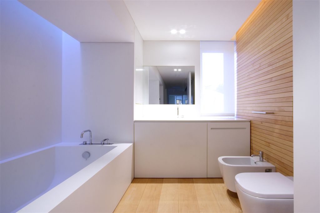 Ultra modern bathroom featuring large bath matching all white interior. Ultra modern bathroom featuring large bath matching all white interior.