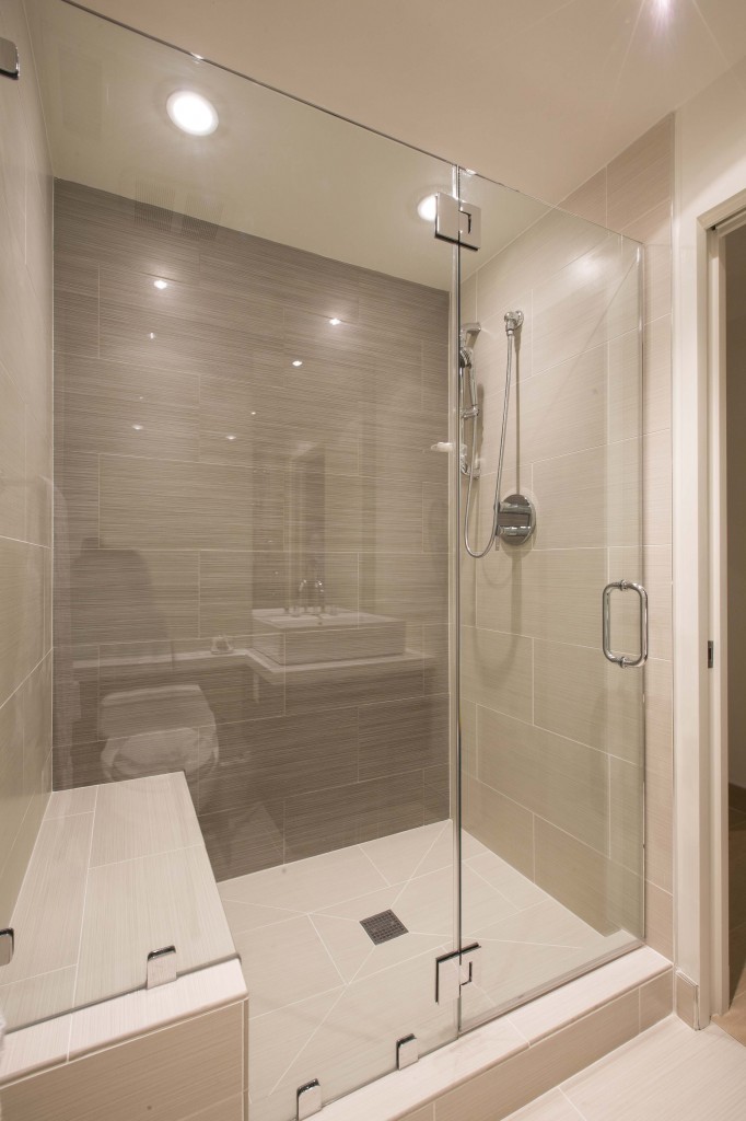 Large glass door shower in bathroom. Large glass door shower in bathroom.