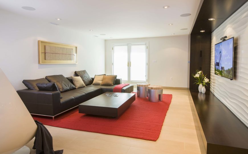 Second view of living room featuring white, black, and red theme. Second view of living room featuring white, black, and red theme.
