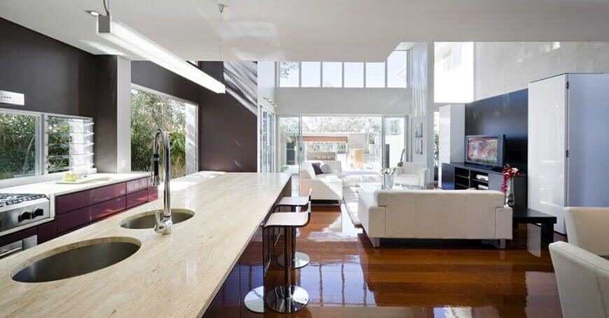 This sleek and minimal pendant light creates a clean, bright light for the space the requires little extra lighting. Reflective surfaces help to extend the reach of the lighting.