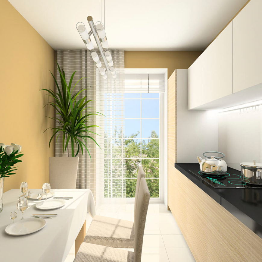 This modern, minimal hanging light creates an interesting visual to the precise lines of this kitchen. Frosted tubes cast a subtle glow to illuminate both functional areas of the room.