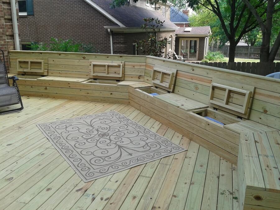  wooden deck design with built-in benches for seating and storage. The