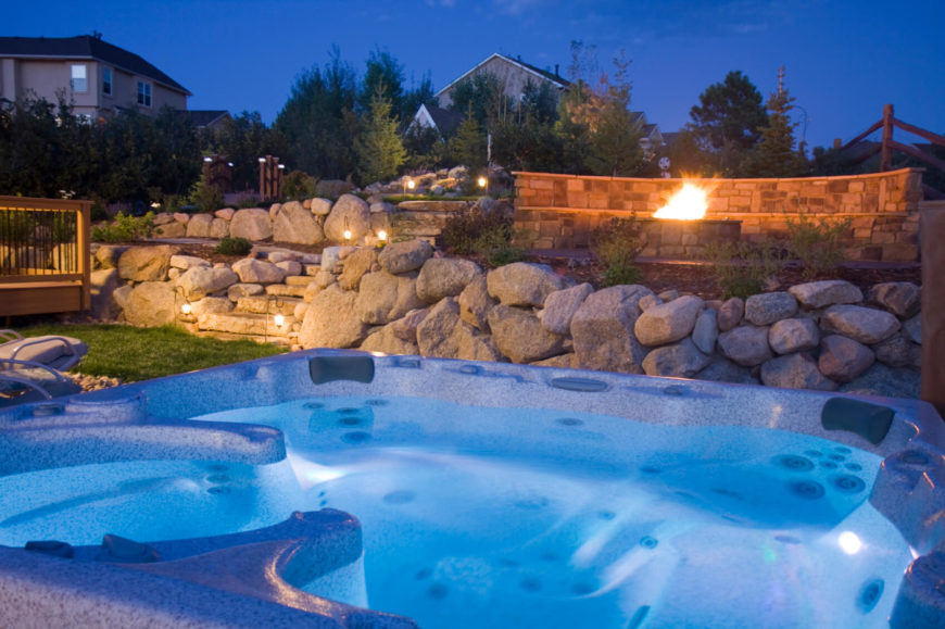 Hot Tub In Backyard Ideas stunning round hot tub idea surrounded by flowers on backyard deck If You Have Put In A Great Deal Of Work Into Your Landscaping And Lighting Of Hot Tub In Backyard Ideas hot tub backyard design ideas images If You Have Put In A Great Deal Of Work Into Your Landscaping And Lighting Of