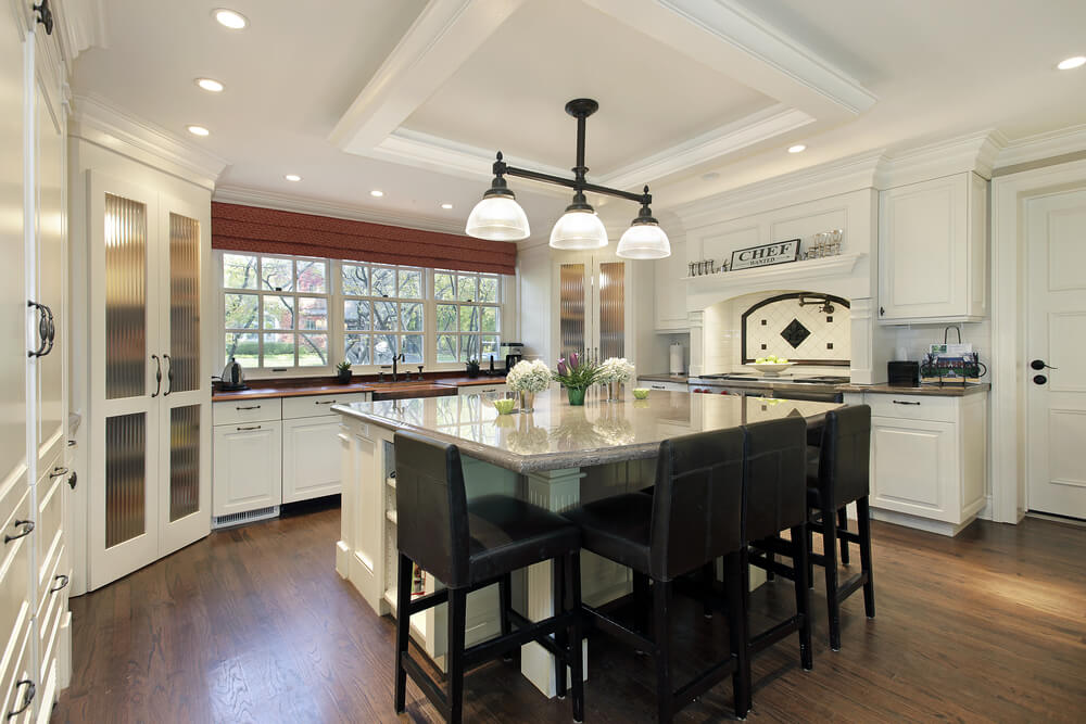 64 Deluxe Custom Kitchen Island Designs (BEAUTIFUL) White kitchen with large square white island and dark stools.