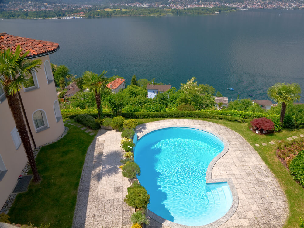 aerial view of pool in the backyard of home high up on a hill overlooking other - Backyard Design With Pool aerial view of pool in the backyard of home high up on a hill overlooking other - Backyard Design With Pool