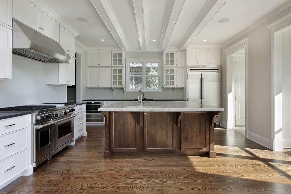 wood kitchen with white island        <h3 class=