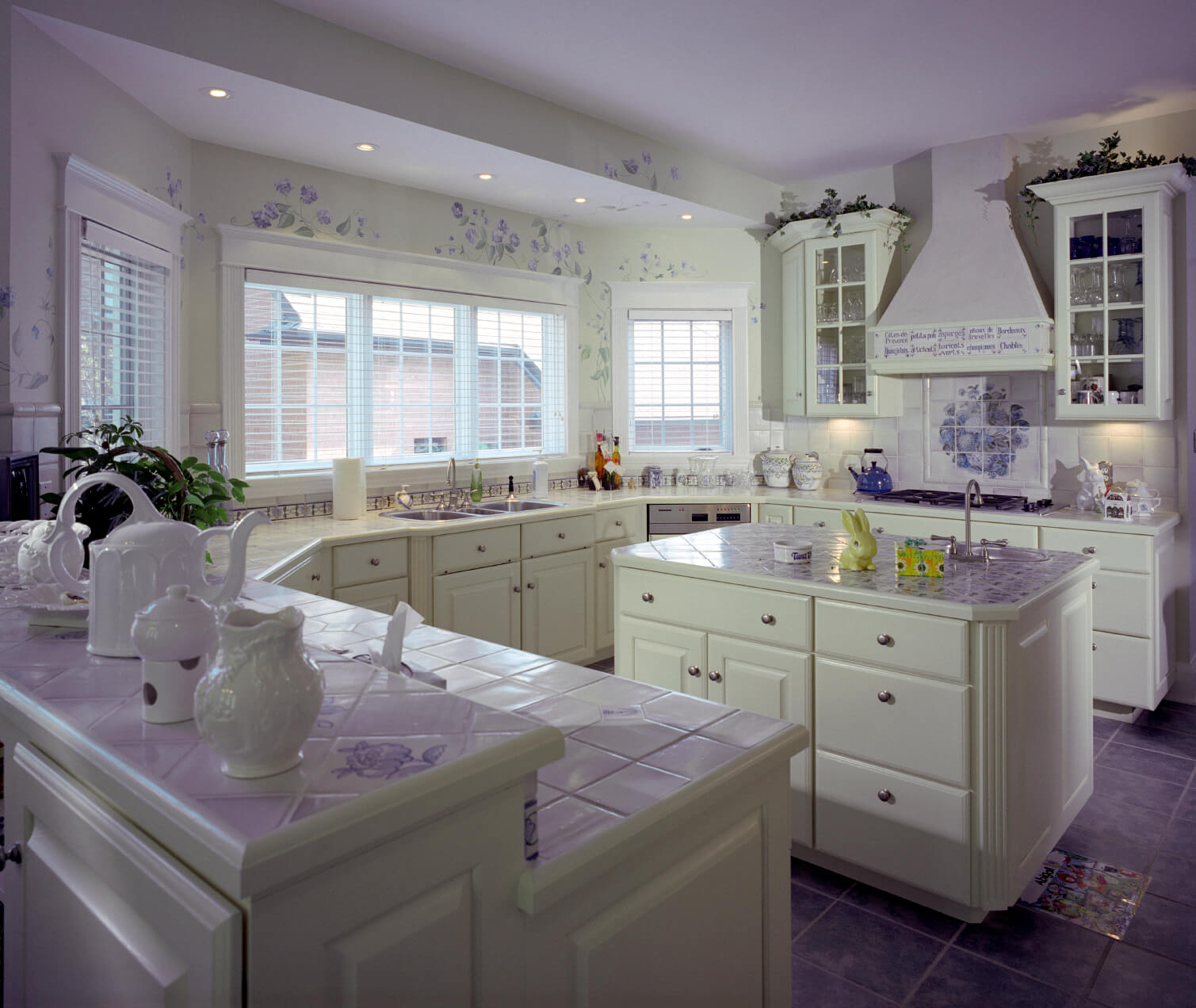 41 White Kitchen Interior Design & Decor Ideas (PICTURES)  This white kitchen is enlivened by a smattering of purple throughout:  purple tile flooring,