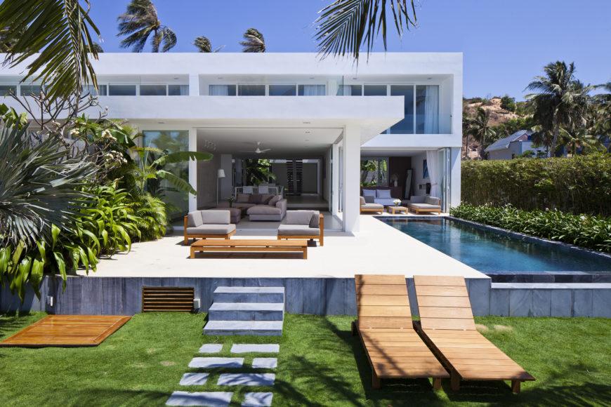 Ocean facing portion extends interior space over this raised patio, with seating on left and infinity pool on right. Stone pathway leads toward beach. Ocean facing portion extends interior space over this raised patio, with seating on left and infinity pool on right. Stone pathway leads toward beach.