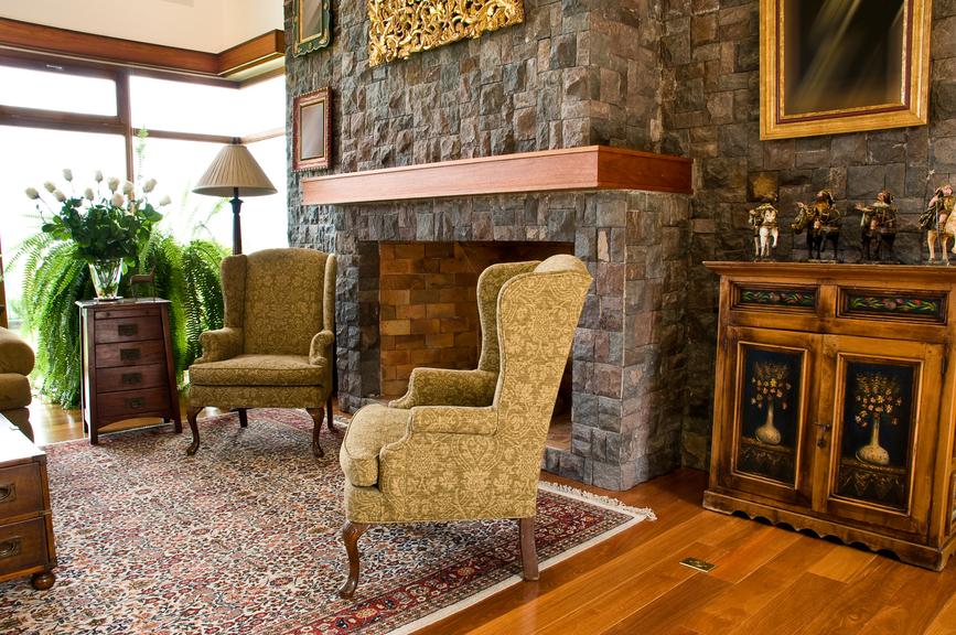 Lush textures define this cozy living room. Stone fireplace surround 