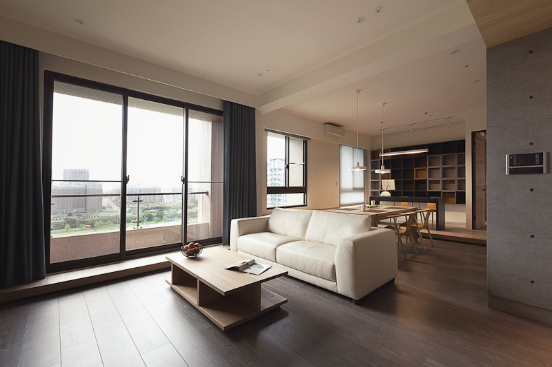Plus white leather contemporary sofa defines the divide between living room and dining area in the large central open space. Concrete and white walls wrap the natural tones throughout. Plus white leather contemporary sofa defines the divide between living room and dining area in the large central open space. Concrete and white walls wrap the natural tones throughout.