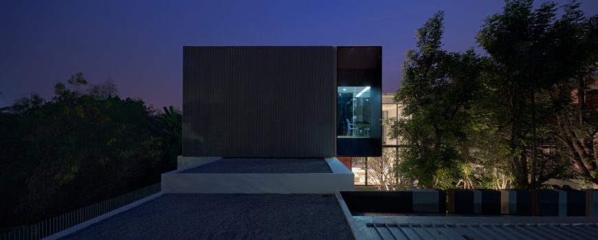Seen over the lower section roof, we see the cantilevered piece of the upper level hanging over the courtyard. Seen over the lower section roof, we see the cantilevered piece of the upper level hanging over the courtyard.