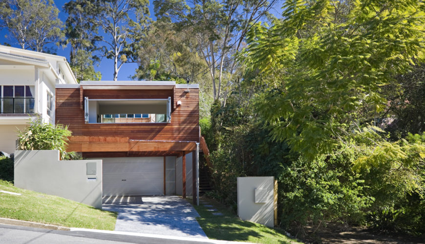 The minimalist box shape of the exterior allows for a surprising amount of innovation within and without. The timber cladding adds a natural element to the contemporary shape. The minimalist box shape of the exterior allows for a surprising amount of innovation within and without. The timber cladding adds a natural element to the contemporary shape.