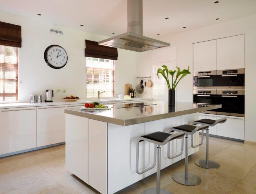 Beautiful modern dining room in white with accents of burgundy and black. Beautiful modern dining room in white with accents of burgundy and black.