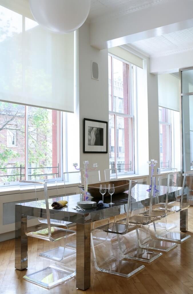 this contemporary dining room has smooth one line transparent chairs and a metallic dining table - Dining Chairs In Living Room this contemporary dining room has smooth one line transparent chairs and a metallic dining table - Dining Chairs In Living Room