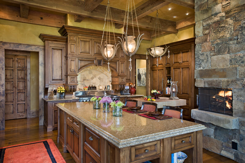 a grand rustic country kitchen with a stone fireplace and distressed cabinetry and trim - Country Kitchen Lighting Ideas a grand rustic country kitchen with a stone fireplace and distressed cabinetry and trim - Country Kitchen Lighting Ideas
