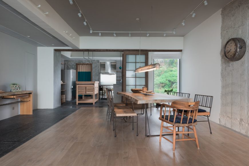 Looking into the dining area, the natural wood tones take the spotlight. The overhanging light, tabletop and wood floors add to the sense of depth within the room. Looking into the dining area, the natural wood tones take the spotlight. The overhanging light, tabletop and wood floors add to the sense of depth within the room.