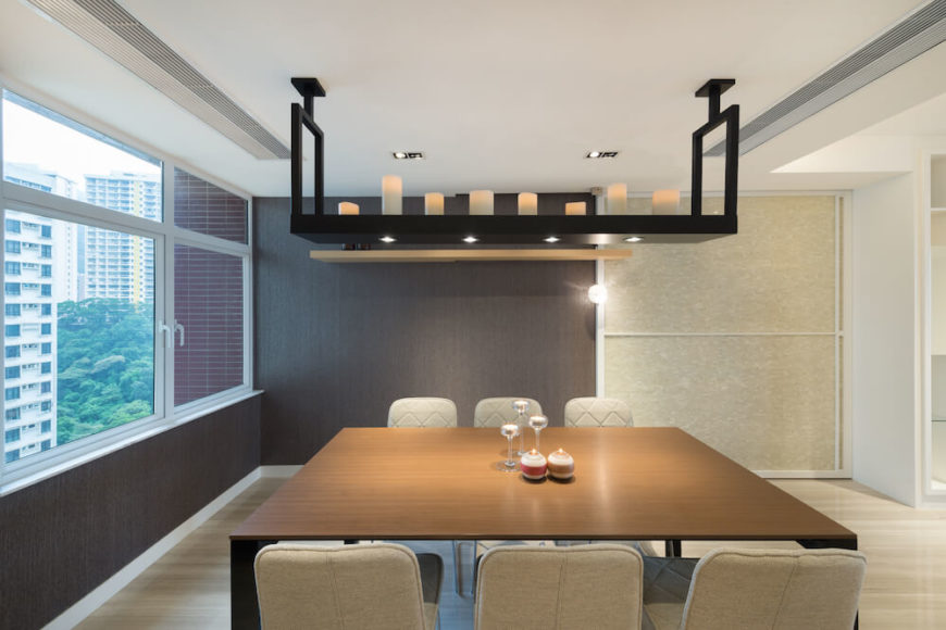 The dining room is full of natural wood work, and has a splendid view of the city. A shelf above the table holds delicate candles to offer a tranquil amber glow. The dining room is full of natural wood work, and has a splendid view of the city. A shelf above the table holds delicate candles to offer a tranquil amber glow.