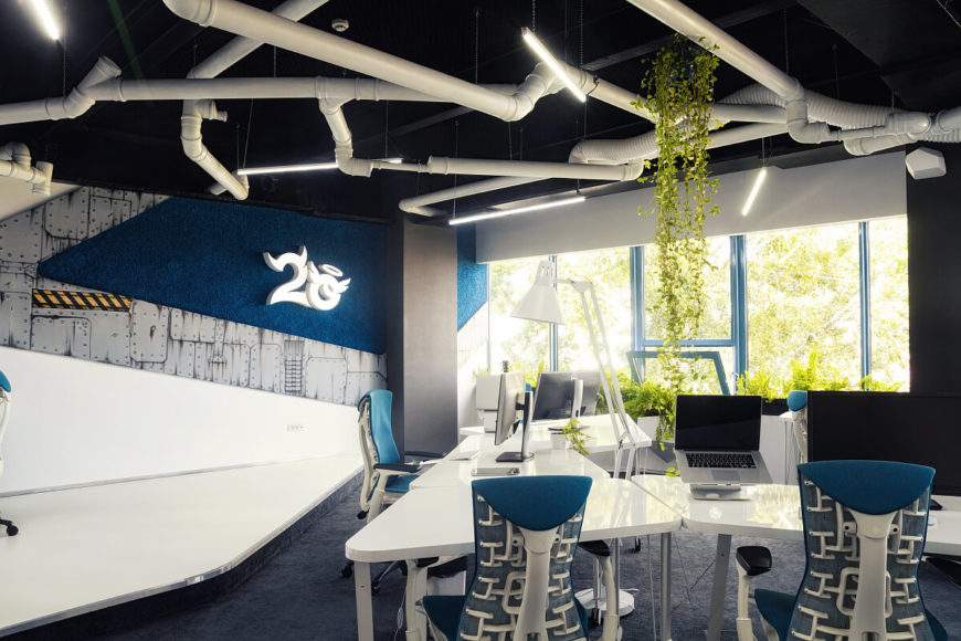Here we can see the hand-drawn comic style decals on the wall, as well as the 2O logo. A healthy green vines spills down from the ceiling and around the office for a bright color scheme against the blues and whites. Here we can see the hand-drawn comic style decals on the wall, as well as the 2O logo. A healthy green vines spills down from the ceiling and around the office for a bright color scheme against the blues and whites.