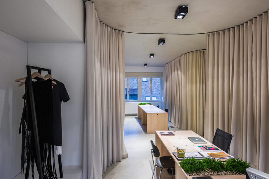 Here's another example of how the curtains can create highly distinct areas that may allow for better focus on a range of specialized work. This corner houses an elegant white display space. Here's another example of how the curtains can create highly distinct areas that may allow for better focus on a range of specialized work. This corner houses an elegant white display space.