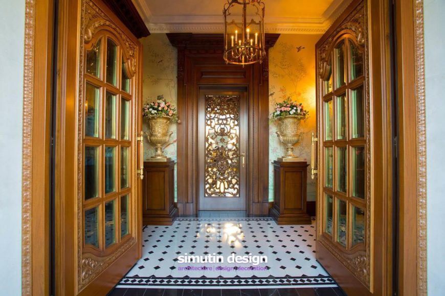 Entry to the home is provided through two incredible rich golden wood doors. The entry is rather narrow, with a single gilded door leading out. The walls are lined with gilded urns filled with fresh flowers. Subtle murals of trees and birds grace the walls. Entry to the home is provided through two incredible rich golden wood doors. The entry is rather narrow, with a single gilded door leading out. The walls are lined with gilded urns filled with fresh flowers. Subtle murals of trees and birds grace the walls.