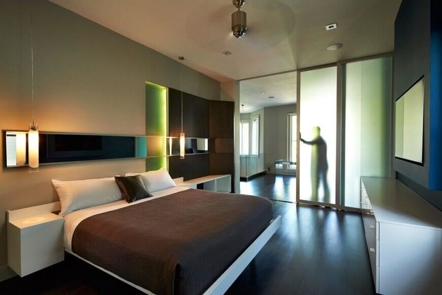 White furniture in this gorgeous modern room makes for excellent contrast against the chocolate brown and beige. Accents of neon green bring a touch of fun to the room. White furniture in this gorgeous modern room makes for excellent contrast against the chocolate brown and beige. Accents of neon green bring a touch of fun to the room.