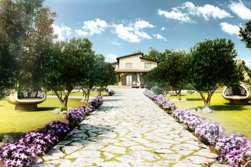 Approaching the villa along a flower-lined stone path, we can see the surrounding landscape is dotted with a carefully laid arrangement of trees and manicured lawn. The home itself stands in the distance in light stone hues. Approaching the villa along a flower-lined stone path, we can see the surrounding landscape is dotted with a carefully laid arrangement of trees and manicured lawn. The home itself stands in the distance in light stone hues.