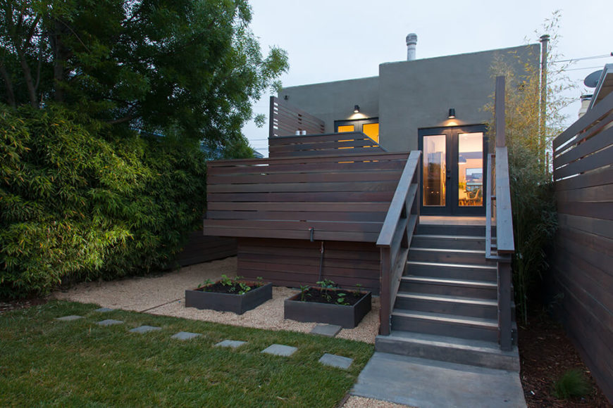 Here's a close look at the beautiful split-level deck wrapping the rear of the home, creating an intimate transition from the indoors to the open back yard. Here's a close look at the beautiful split-level deck wrapping the rear of the home, creating an intimate transition from the indoors to the open back yard.