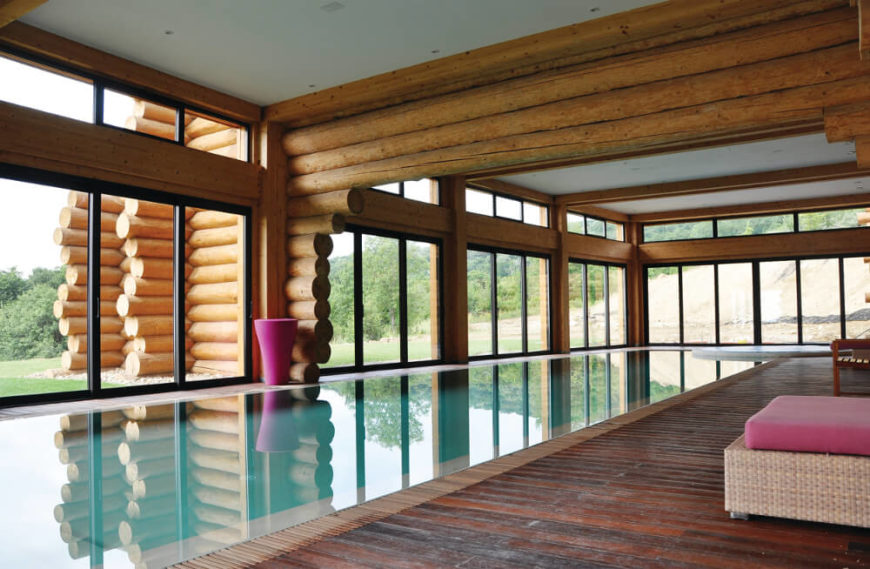 The pool room is an expansive, open interior space completely wrapped in full height windows for an open, airy look. The dehumidification elements work here to keep the home free of any possible moisture damage. The pool room is an expansive, open interior space completely wrapped in full height windows for an open, airy look. The dehumidification elements work here to keep the home free of any possible moisture damage.