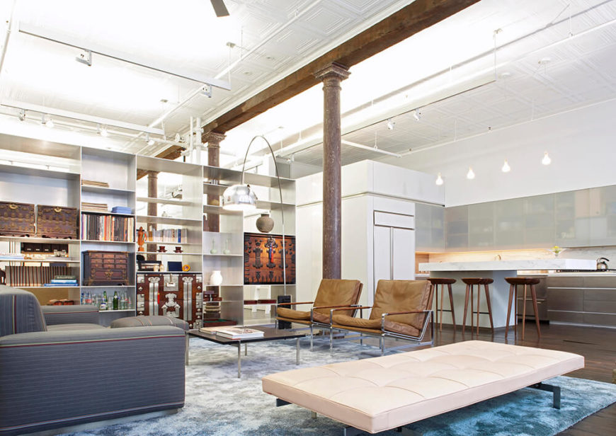 The living room is dominated by a built-in metal display shelf that was designed to house the owners traditional Korean trunk collection. This display also works to divide the three spaces of the loft — living and kitchen, the study, and the sleeping area. The silk rug was custom designed by Slade Architects to fade from blue around the edges to silver in the center. The living room is dominated by a built-in metal display shelf that was designed to house the owners traditional Korean trunk collection. This display also works to divide the three spaces of the loft — living and kitchen, the study, and the sleeping area. The silk rug was custom designed by Slade Architects to fade from blue around the edges to silver in the center.
