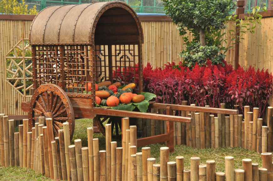 This is an example of a different design, with tall bamboo shades and stalks pressed into the ground to form a tall edging around a vegetable cart. The tall panels of the fence are occasionally interrupted by octagonal cutouts with a beautiful, simple design. This is an example of a different design, with tall bamboo shades and stalks pressed into the ground to form a tall edging around a vegetable cart. The tall panels of the fence are occasionally interrupted by octagonal cutouts with a beautiful, simple design.