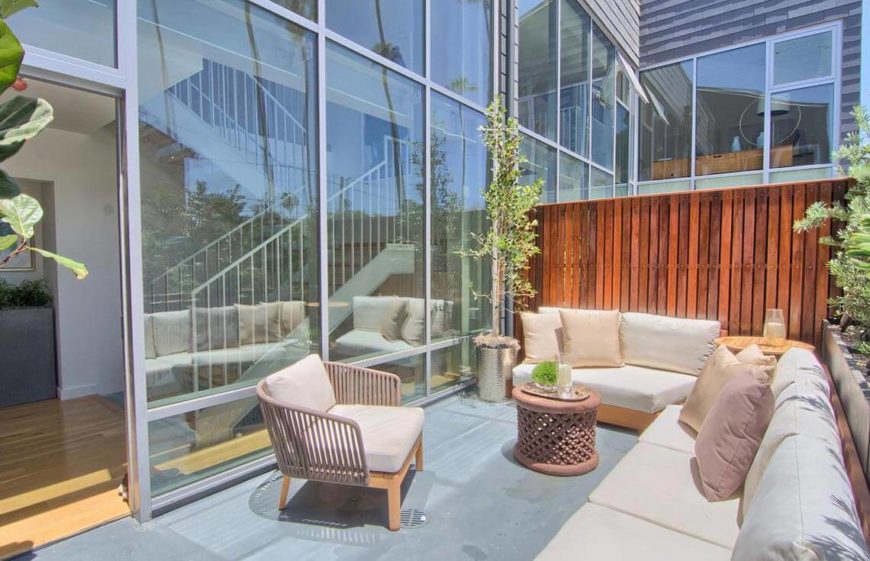 This lovely staged patio shows the natural colors that look bright and inviting in the sun, and also lets prospective buyers project their own design ideas onto the space. The seating is arranged in a way to make a nice conversation area, a place where a party or gathering would fit perfectly. This patio invites people to just sit down and hang out. The plants are an amazing addition, bringing vibrancy and life to the area. This lovely staged patio shows the natural colors that look bright and inviting in the sun, and also lets prospective buyers project their own design ideas onto the space. The seating is arranged in a way to make a nice conversation area, a place where a party or gathering would fit perfectly. This patio invites people to just sit down and hang out. The plants are an amazing addition, bringing vibrancy and life to the area.
