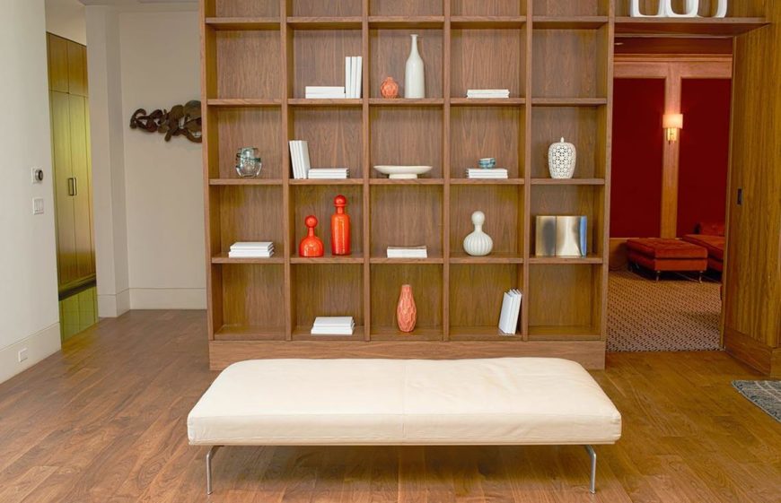 Here is a bright and simple entrance way, with a welcoming seat and simple design elements on a shelving unit. The brightness and clutter free nature of this space makes a good and welcoming entrance into the rest of the home. It is easy for a foyer to become laden with jacket and shoes, but show off the space by keeping this area as clean as possible. Here is a bright and simple entrance way, with a welcoming seat and simple design elements on a shelving unit. The brightness and clutter free nature of this space makes a good and welcoming entrance into the rest of the home. It is easy for a foyer to become laden with jacket and shoes, but show off the space by keeping this area as clean as possible.