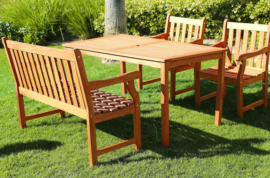 Some tables have a variety of seating options. This table has a bench as well as two matching chairs. It gives people at the table a bit of a choice in their seating arrangements. 