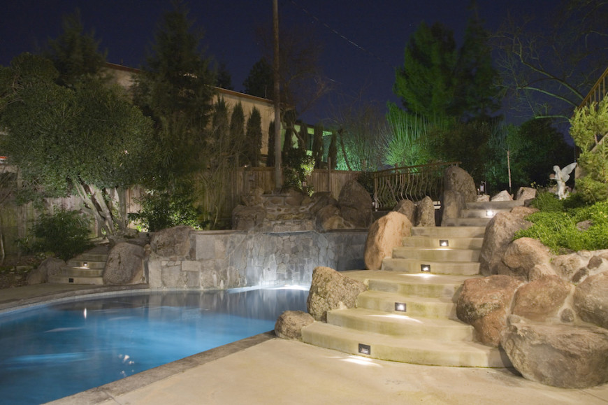 Here we see step lighting highlighting stone stairs. Without these step lights, it may be difficult to see the steps late at night. Tripping down these stairs could potentially be dangerous. For safety alone these lights are worth their weight. It is a bonus that they look great too.