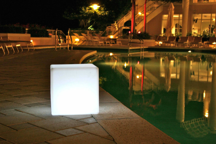 This cute outdoor lamp has a unique visual appeal. The light cube casts light in every direction. It also gives your backyard area a special draw.