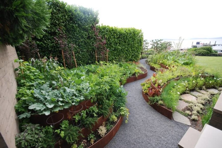 Stacked pots and raised garden beds can give your large garden depth and add dynamics. They can increase the appeal and cultivate a clean and organized look. Stacked pots and raised garden beds can give your large garden depth and add dynamics. They can increase the appeal and cultivate a clean and organized look.