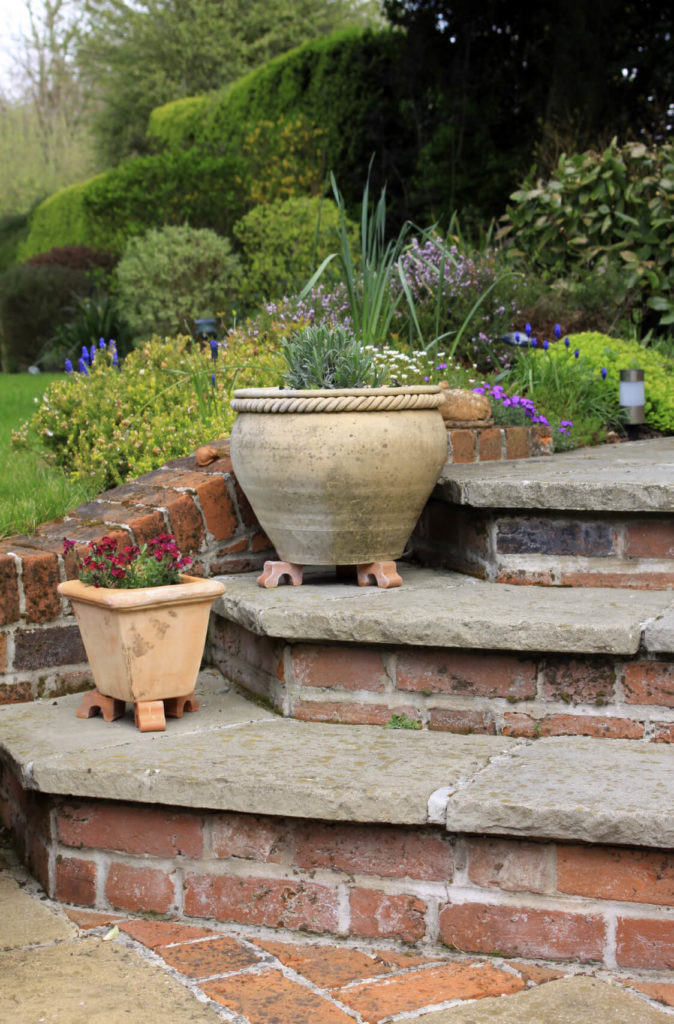 Brick and stone work well together. Stone top steps on brick bases is a great look that is timeless and classic. This style fits with nearly any design choice. Brick and stone work well together. Stone top steps on brick bases is a great look that is timeless and classic. This style fits with nearly any design choice.